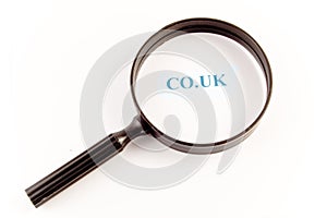 CO.UK through a Magnifying glass on a white background.