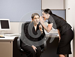 Co-workers gossiping