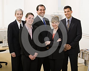 Co-workers posing in office