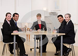 Co-workers sitting at conference table