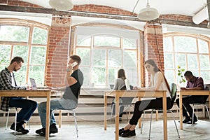 Co-working space concept, diverse people working in shared offic photo