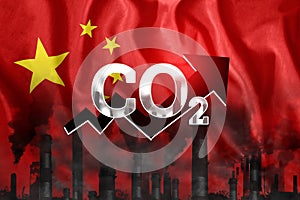 CO2 emissions into the atmosphere. Pipes with black smoke against the background of the China flag. Industrial air pollution