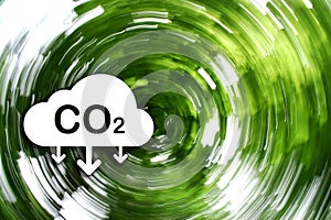 CO2 reducing icon and rotating blurred green forest. Concept of CO2 reduction for the environment