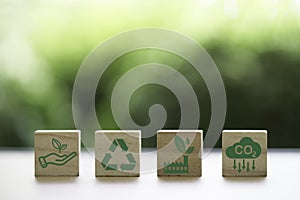 CO2 reducing ,Recycle ,Green factory icon on greenery background for decrease CO2 , carbon footprint and carbon credit to limit