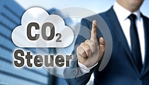 CO2 Steuer in german carbon tax concept is shown by businessman