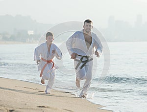 coach and boy in a kimono run