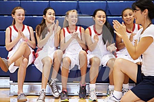 Coach Of Female High School Basketball Team Gives Team Talk