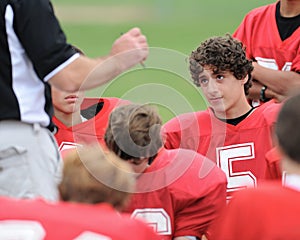 Coach lectures player at halftime