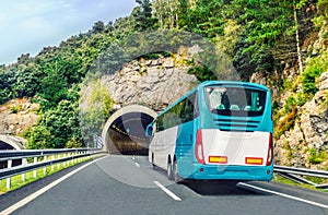 Coach, long haul bus, drives through a tunnel in northern Spain