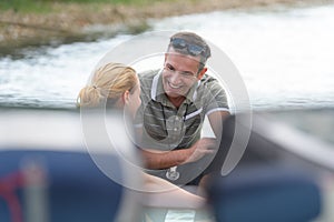 coach talking to lady performing watersports photo