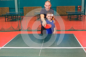 Coach teaches the Igart and table tennis. practice of the blow in table tennis