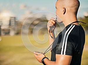 Coach, whistle and sport training with stopwatch, exercise and time athlete on field or pitch in summer. Expert