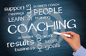 Coaching Business Concept - female hand writing text