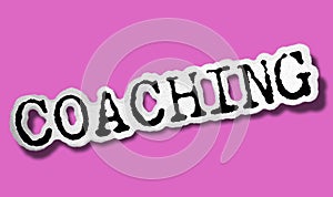 Coaching - Flat Paper Word on Pink Background