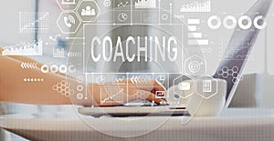 Coaching with woman using a laptop