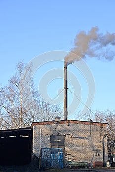 Coal boiler room with the smoking pipe. Kaliningrad region, Russ photo