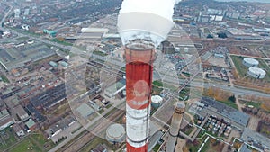 Coal fire power statio. Smokig pipe, close up. Aerial.