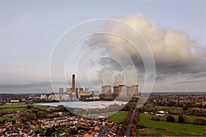 A coal fired power station and factory with carbon dioxide emissions and poisonous cloud
