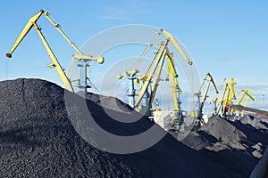 Coal is loaded into the holds of a dry cargo ship in the seaport 24 hours a day.