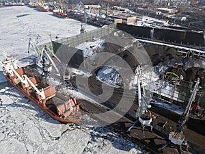 Coal loading on a vessel in port