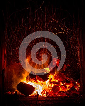 Coal and logs burning fire