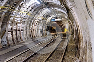 Coal mine tunnel with rail tracks