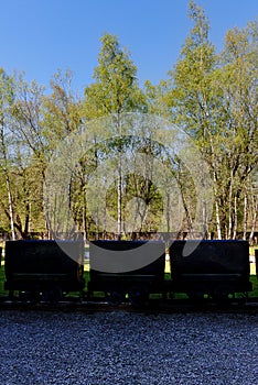 Coal mining cart, trees, park, Marcinelle, Charleroi, Belgium photo
