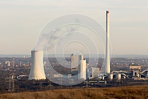 Coal power plant on setting evening sun photo