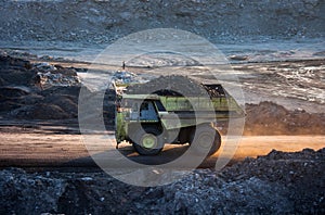 Coal-preparation plant. Big mining truck at work site coal trans