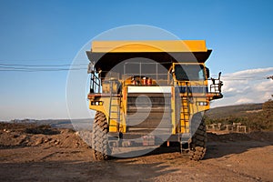 coal-preparation plant. Big yellow mining truck at work site coal transportation