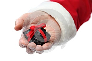 a coal on santa claus hand photo