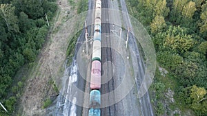 Coal train aerial view. An electric locomotive with freight cars or a railway carriage travels by rail.A train with coal is travel