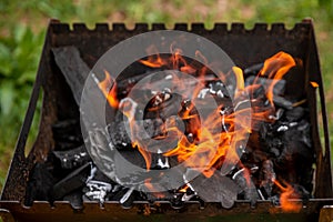 coals smolder in a brazier