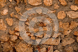 coarse shell rock masonry of stone wall, background and texture