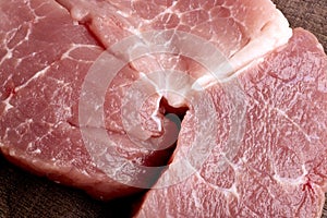 Coarsely chopped pieces of pork. Raw meat before cooking. The concept of cholesterol food.