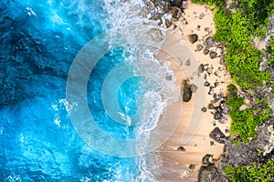 Coast as a background from top view. Turquoise water background from top view. Summer seascape from air. Bali island, Indonesia. photo