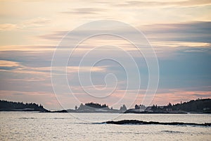 The coast of the Atlantic Oken. Rocky islands at sunset. USA. Maine.