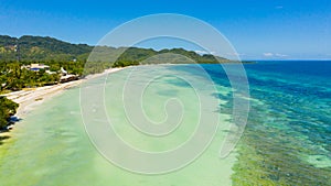 Coast with a beach and blue sea. Anda Bohol, Philippines.