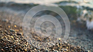 The coast of the Black Sea strewn with pebbles. Abstract natural landscape background concept of sea shores and waves