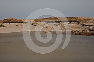 Coast in Bretagne Brittany with a sandy beach and cliffs