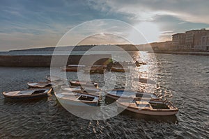 Coast and buildings of Naples, Italy at sunset