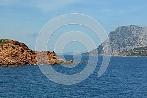 The coast of Capo Coda di Cavallo, in background the island of Tavolara