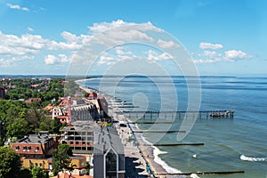 The coast of the city of Zelenogradsk with a view of the embankment, houses and pier, top view