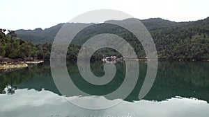 Coast of green mountain river view from boat in Patagonia Argentina.