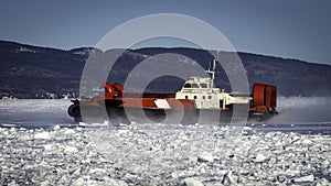 Coast Guard hovercraft breaking ice near a small community in eastern Quebec, Canada.