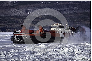 Coast Guard hovercraft breaking ice near a small community in eastern Quebec, Canada. photo