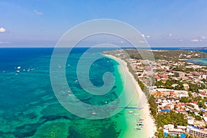 The coast of the island of Boracay. White beach and clear sea. Seascape with a beautiful coast in sunny weather.