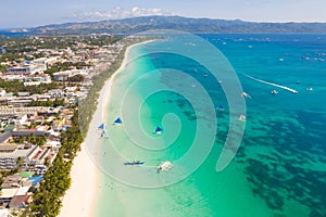 The coast of the island of Boracay. White beach and clear sea. Seascape with a beautiful coast in sunny weather.