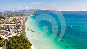 The coast of the island of Boracay. White beach and clear sea. Seascape with a beautiful coast in sunny weather.