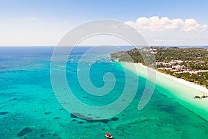 The coast of the island of Boracay. White beach and clear sea. Seascape with a beautiful coast in sunny weather